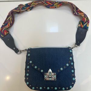 Valentino Garavani Rockstud Rolling Small Denim Guitar-Strap Cross Body Bag